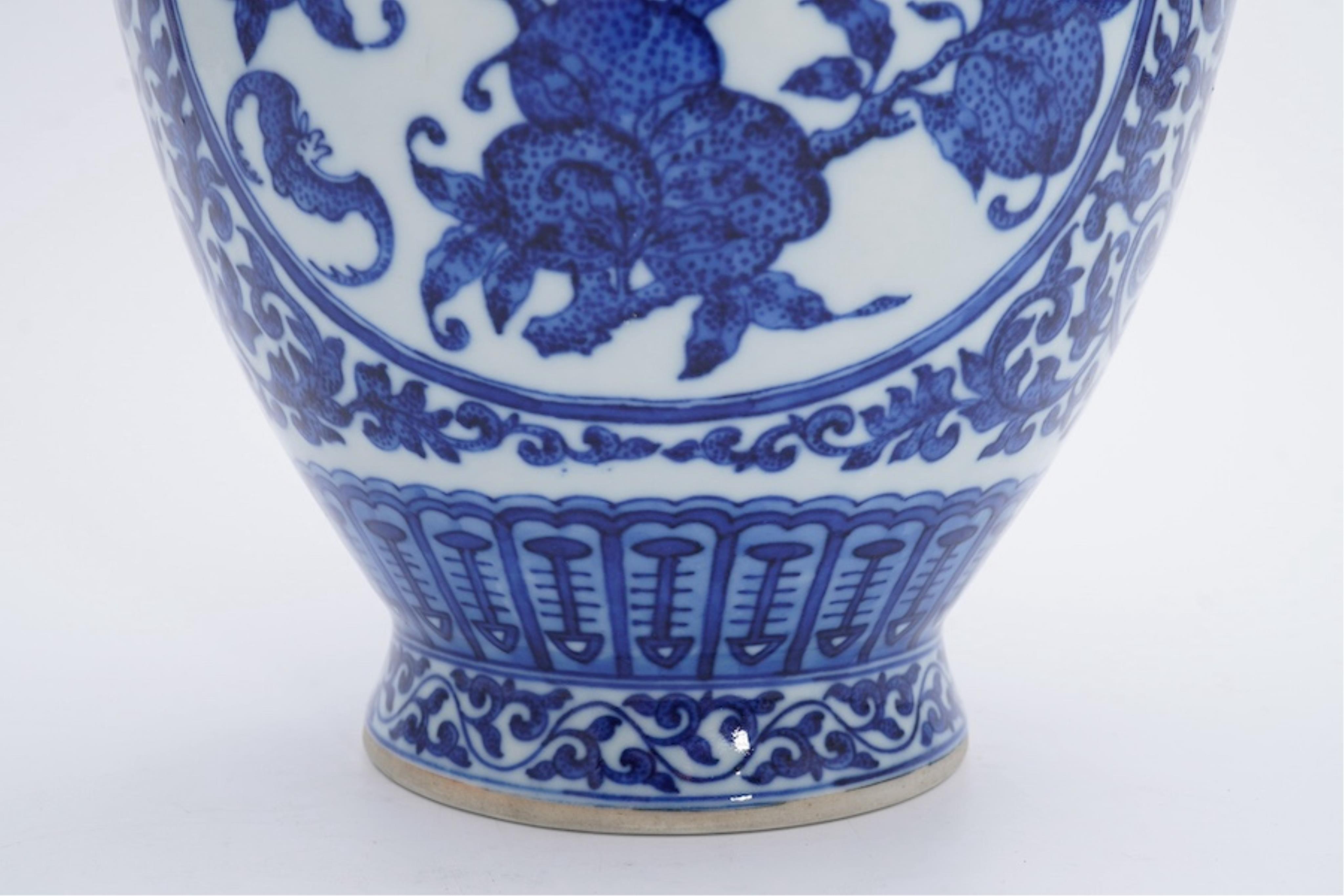A Chinese blue and white 'peaches' vase, Qianlong mark but later, 27cm high. Condition - good